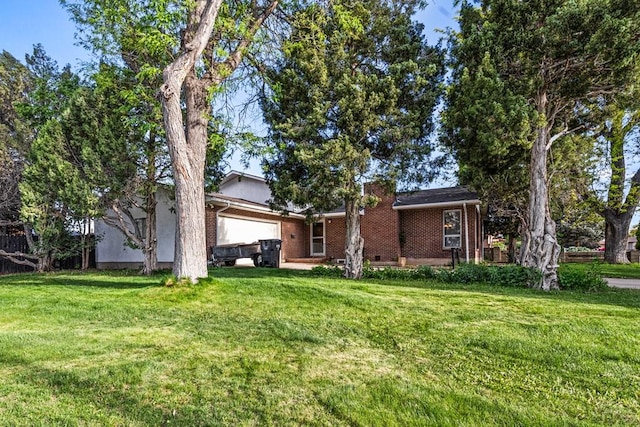 36 Loyola Ln, Pueblo, CO 81005 - view of front facade featuring a garage, a front lawn, and brick siding