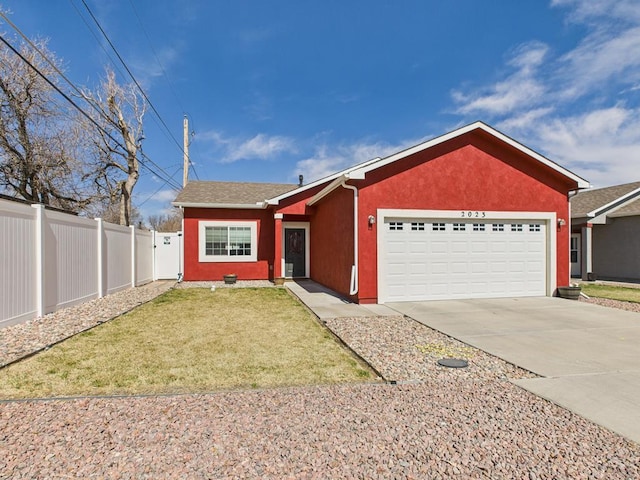 ranch-style home with fence, roof with shingles, concrete driveway, a front lawn, and a garage