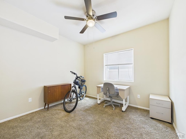 home office featuring carpet flooring, baseboards, and ceiling fan