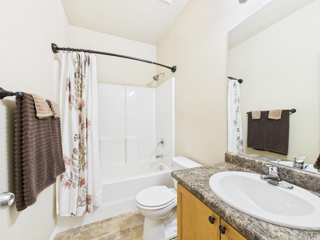 bathroom with vanity, toilet, and shower / bath combo with shower curtain