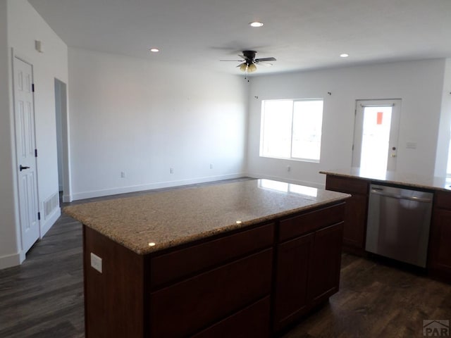 kitchen featuring recessed lighting, dishwasher, a center island, and dark wood-style flooring