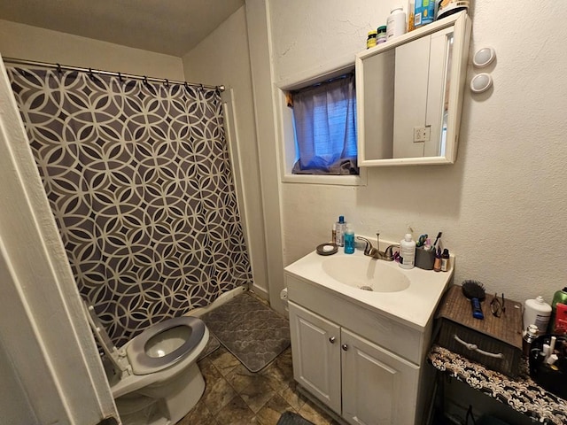 full bath with a shower with shower curtain, a textured wall, vanity, and toilet