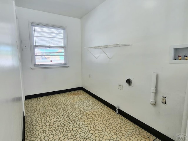 laundry room featuring laundry area, baseboards, tile patterned floors, hookup for a washing machine, and electric dryer hookup