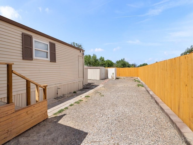 353 E Byrd Dr, Pueblo West, CO 81007 - fenced backyard featuring a storage unit