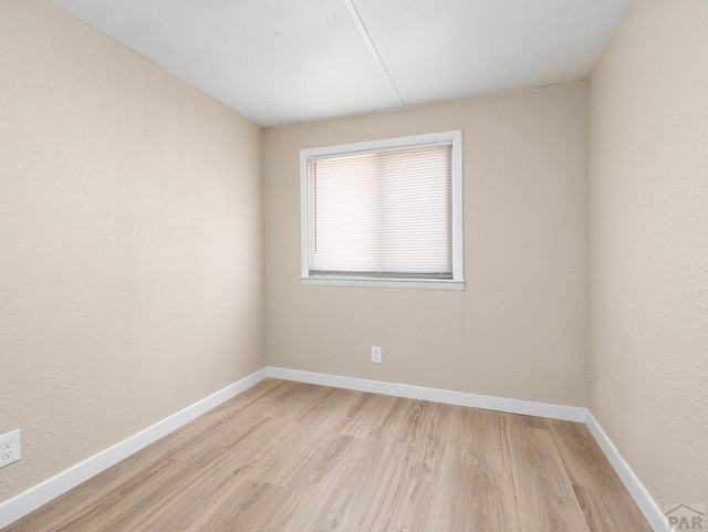 353 E Byrd Dr, Pueblo West, CO 81007 - spare room with light wood-style flooring and baseboards