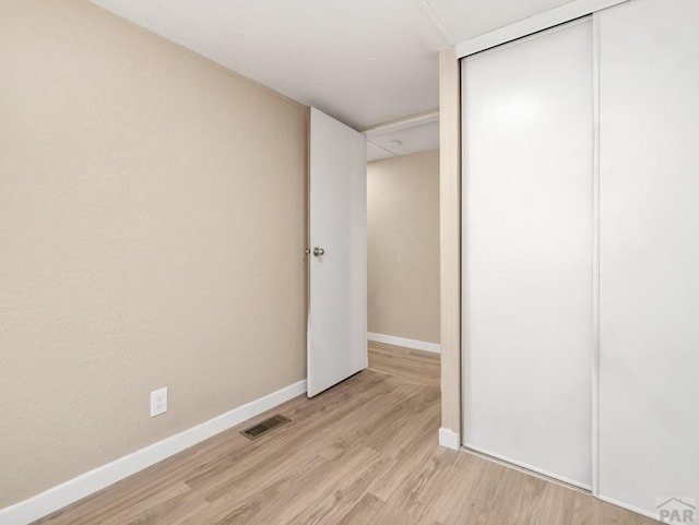 353 E Byrd Dr, Pueblo West, CO 81007 - unfurnished bedroom with light wood finished floors and a closet