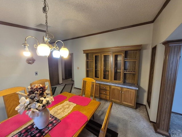 1106 10th St, Las Animas, CO 81054 - dining area with crown molding, light colored carpet, a textured ceiling, and a chandelier