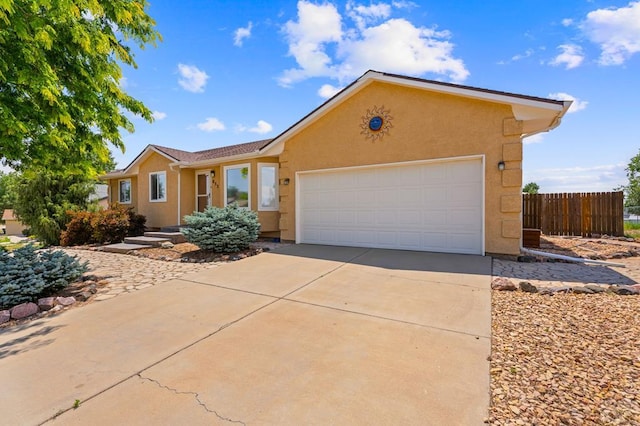 853 S Blakeland Dr, Pueblo West, CO 81007 - ranch-style home featuring stucco siding, driveway, and a garage