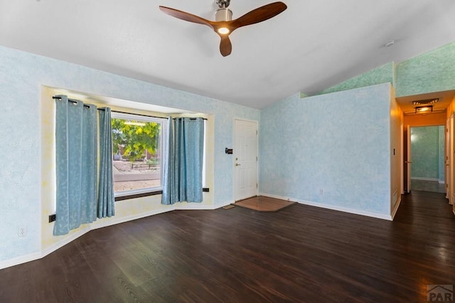853 S Blakeland Dr, Pueblo West, CO 81007 - unfurnished living room featuring vaulted ceiling, wood finished floors, ceiling fan, and wallpapered walls