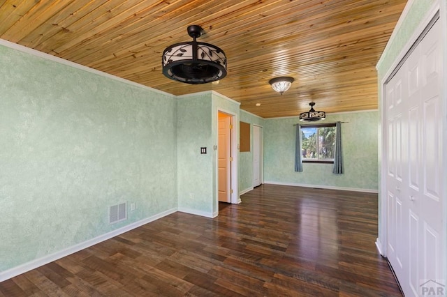 853 S Blakeland Dr, Pueblo West, CO 81007 - spare room with wooden ceiling, wood finished floors, and ornamental molding
