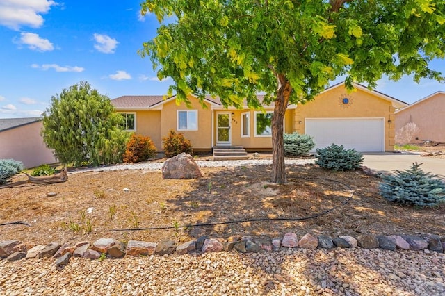 853 S Blakeland Dr, Pueblo West, CO 81007 - ranch-style home featuring driveway, stucco siding, and a garage