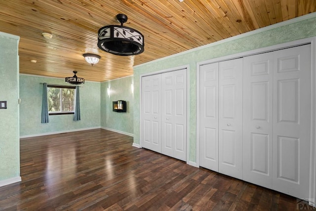 853 S Blakeland Dr, Pueblo West, CO 81007 - unfurnished bedroom featuring wood ceiling, multiple closets, wood finished floors, and ornamental molding
