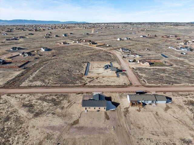 bird's eye view featuring view of desert and a mountain view