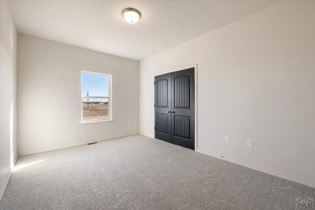 unfurnished bedroom featuring carpet