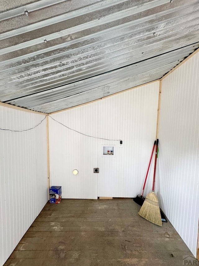 interior space featuring hookup for a washing machine, hookup for an electric dryer, hardwood / wood-style floors, and laundry area