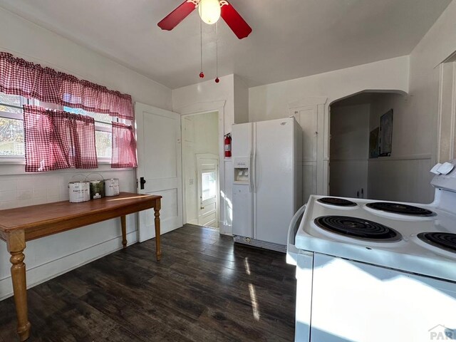 kitchen featuring white appliances, dark wood finished floors, and a ceiling fan