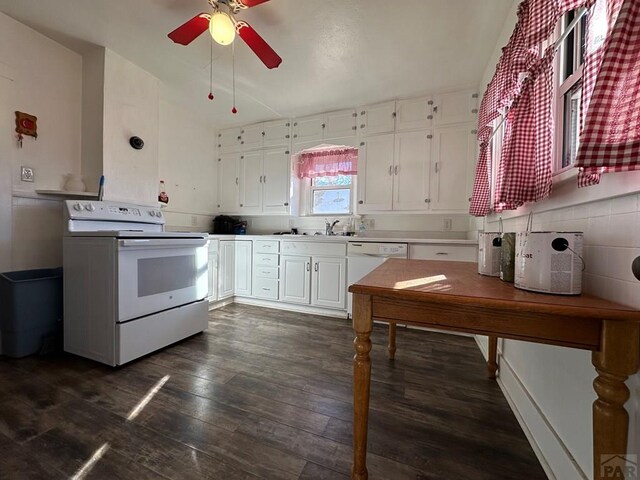 kitchen with white appliances, a ceiling fan, white cabinets, light countertops, and dark wood finished floors