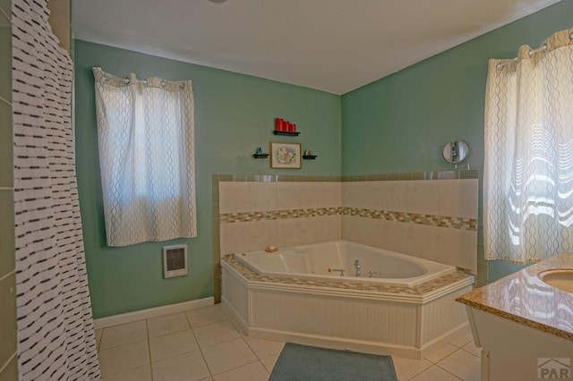 180 Welton Ave, Walsenburg, CO 81089 - full bathroom featuring tile patterned flooring, a whirlpool tub, vanity, heating unit, and baseboards