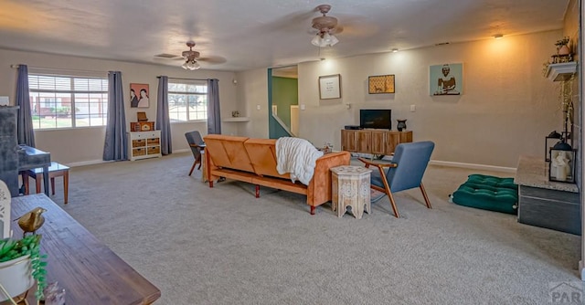 180 Welton Ave, Walsenburg, CO 81089 - living room featuring a ceiling fan, carpet flooring, and baseboards