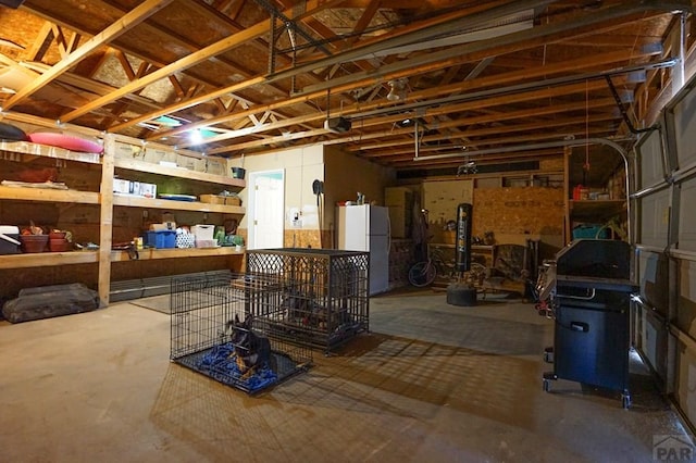 180 Welton Ave, Walsenburg, CO 81089 - basement with freestanding refrigerator and a garage