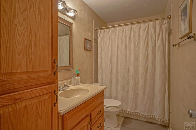 180 Welton Ave, Walsenburg, CO 81089 - bathroom featuring vanity, tile patterned flooring, and toilet