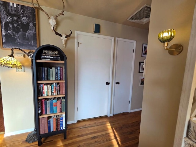 902 Everett, Lamar, CO 81052 - hallway featuring wood finished floors and baseboards