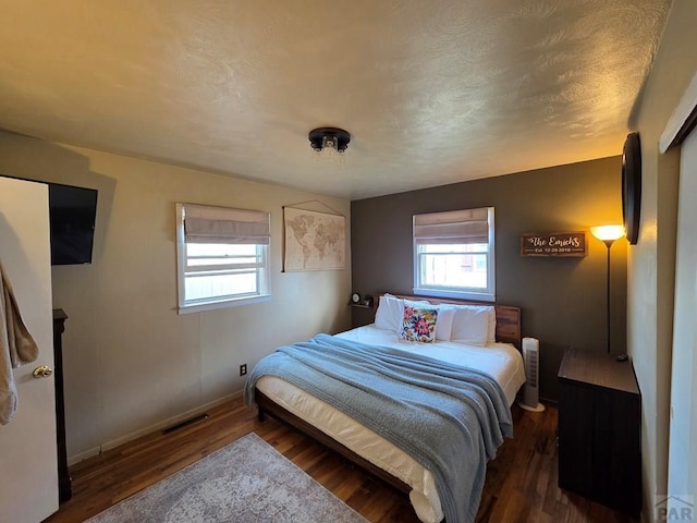902 Everett, Lamar, CO 81052 - bedroom featuring wood finished floors and baseboards
