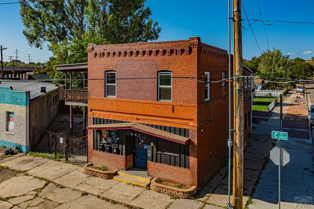 901 E C St, Pueblo, CO 81003 - view of front of house featuring brick siding