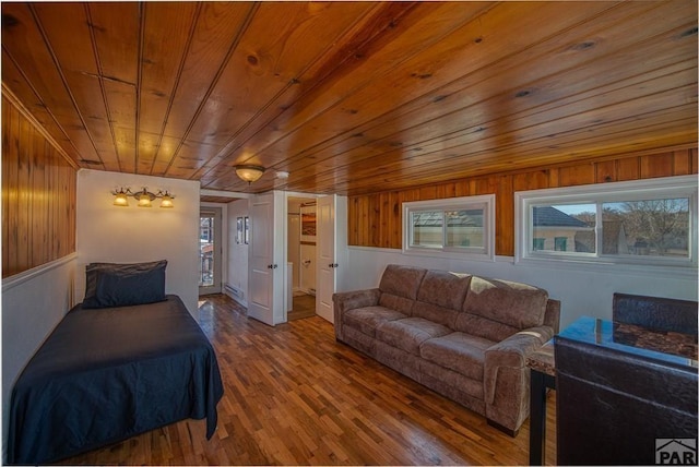 901 E C St, Pueblo, CO 81003 - bedroom featuring wood ceiling, a baseboard heating unit, and wood finished floors