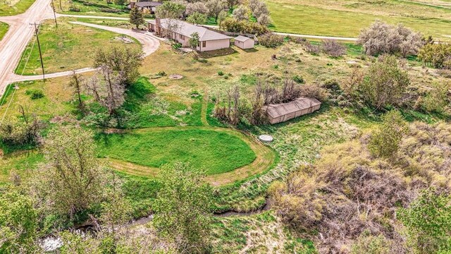 birds eye view of property featuring a rural view