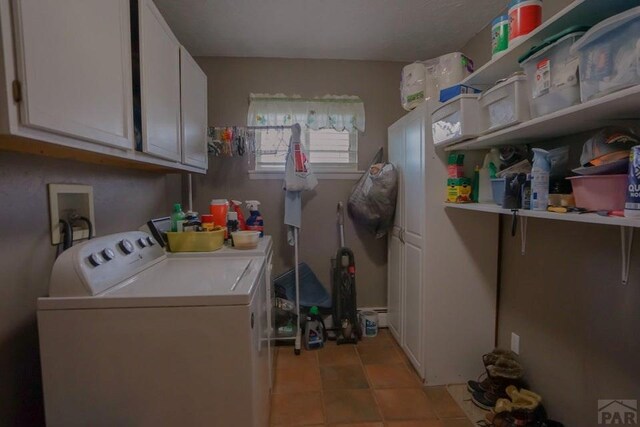 laundry area featuring washing machine and dryer and cabinet space