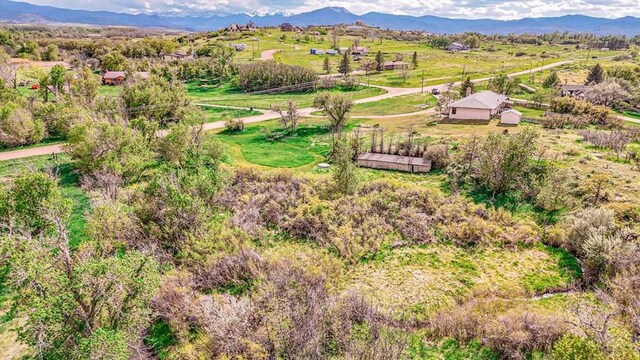 drone / aerial view with a mountain view and a rural view