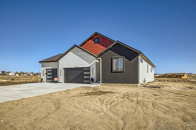 view of front of property with an attached garage and driveway