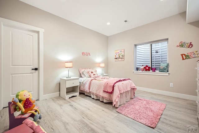 bedroom with light wood-type flooring, visible vents, baseboards, and recessed lighting