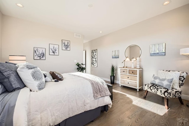 bedroom featuring baseboards, visible vents, dark wood-style flooring, and recessed lighting