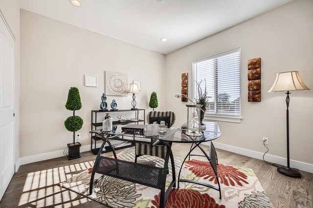 office with recessed lighting, wood finished floors, and baseboards