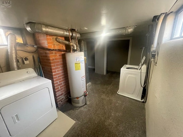 utility room with gas water heater and washing machine and clothes dryer