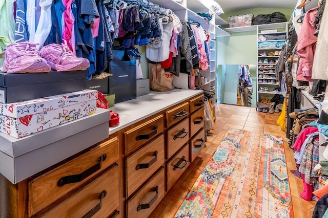 spacious closet featuring light tile patterned flooring