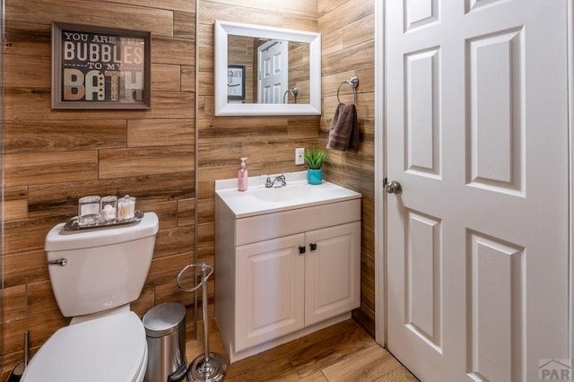 half bathroom featuring toilet and vanity
