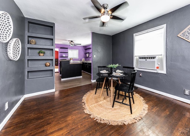 dining area with a ceiling fan, cooling unit, dark wood-style flooring, and baseboards