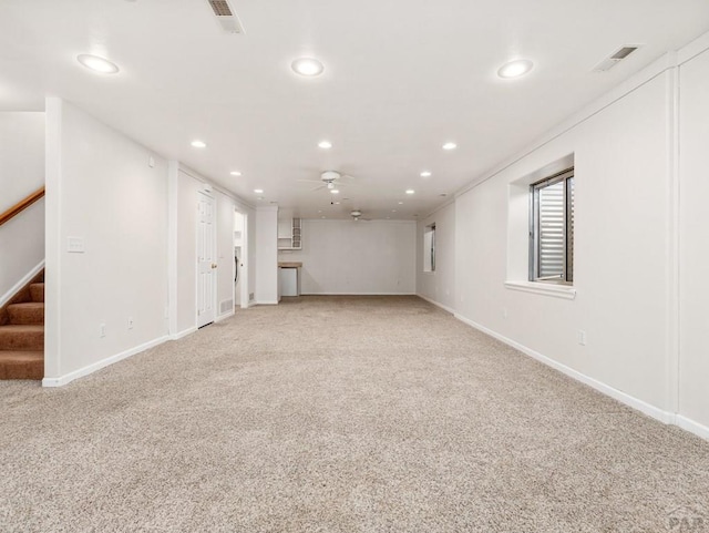 3933 Elk Ln, Pueblo, CO 81005 - interior space with stairway, a ceiling fan, light colored carpet, baseboards, and recessed lighting