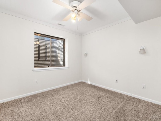 3933 Elk Ln, Pueblo, CO 81005 - carpeted spare room with baseboards, a ceiling fan, and visible vents