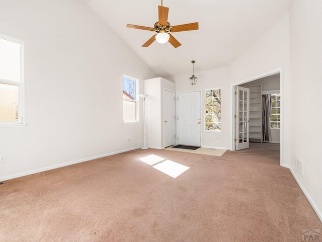 3933 Elk Ln, Pueblo, CO 81005 - interior space featuring baseboards, lofted ceiling, a ceiling fan, and carpet