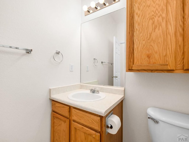 3933 Elk Ln, Pueblo, CO 81005 - half bathroom with vanity and toilet