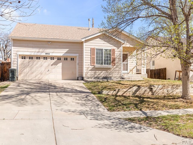 3933 Elk Ln, Pueblo, CO 81005 - single story home featuring a garage, driveway, and fence