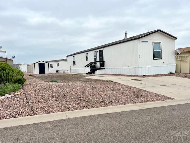 manufactured / mobile home with an outbuilding