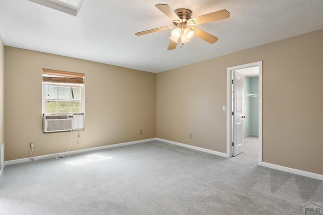 502 S Putter Dr, Pueblo West, CO 81007 - spare room featuring cooling unit, carpet flooring, a ceiling fan, and baseboards