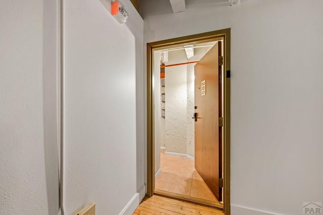 201 Lamkin Unit 205, Pueblo, CO 81003 - hall with light wood-type flooring and baseboards
