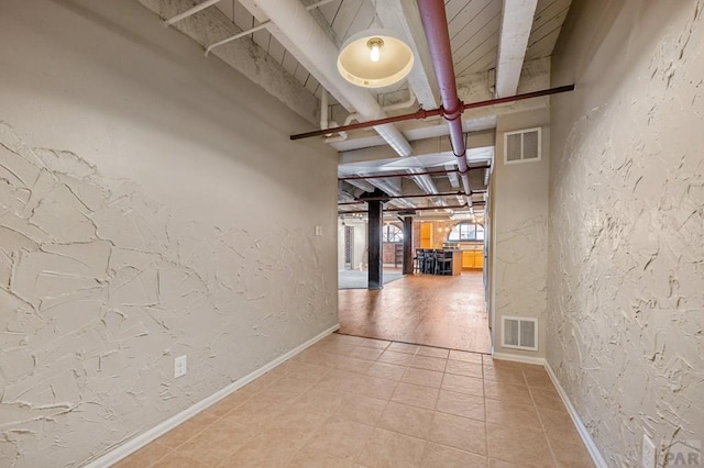 201 Lamkin Unit 205, Pueblo, CO 81003 - corridor featuring a textured wall and light tile patterned flooring