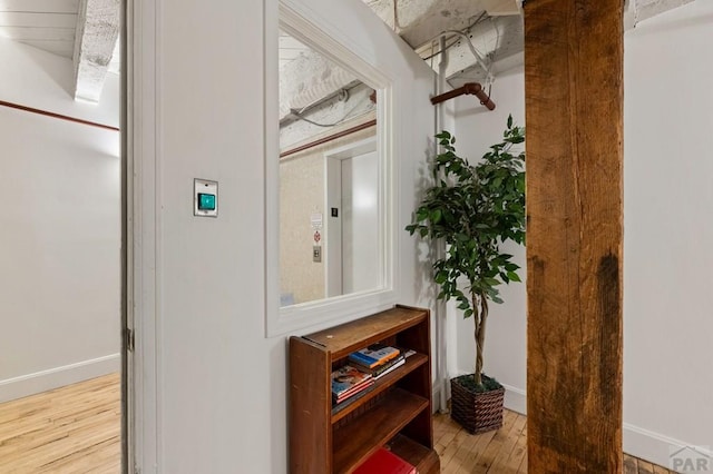 201 Lamkin Unit 205, Pueblo, CO 81003 - corridor featuring wood finished floors and baseboards